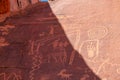 Valley of Fire - Close up view of Native American rock art (Petroglyphs) on red Aztek sandstone wall of Atlatl rock, Nevada Royalty Free Stock Photo