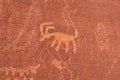 Valley of Fire - Close up view of Native American rock art (Petroglyphs) on red Aztek sandstone wall of Atlatl rock, Nevada Royalty Free Stock Photo