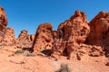 Valley of Fire - Couple at the entrance of windstone arch (fire cave) in Valley of Fire State Park, Mojave desert, Nevada, USA