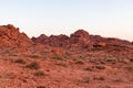 Valley of Fire - Panoramic sunrise view of red and orange Aztec Sandstone Rock formations and desert vegetation, Nevada Royalty Free Stock Photo