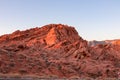 Valley of Fire - Panoramic sunrise view of red and orange Aztec Sandstone Rock formations and desert vegetation, Nevada Royalty Free Stock Photo