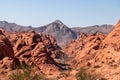 Valley of Fire - Panoramic view of endless winding empty Mouse tank road through canyons of red Aztec Sandstone Rock Royalty Free Stock Photo