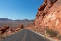 Valley of Fire - Panoramic view of endless winding empty Mouse tank road through canyons of red Aztec Sandstone Rock Royalty Free Stock Photo