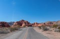 Valley of Fire - Panoramic view of endless winding empty Mouse tank road through canyons of red Aztec Sandstone Rock Royalty Free Stock Photo