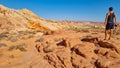 Valley of Fire - Rear view of man at Silica Dome viewpoint overlooking the Valley of Fire State Park in Mojave desert, Nevada, USA Royalty Free Stock Photo