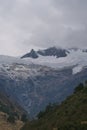 The valley of Jancapampa, Peru with the spectacular view of the peaks and glacier Pucajirca and several streams flowing down into Royalty Free Stock Photo