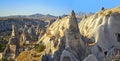 Valley and rocks dramatically lit by a sunrise in Cappadocia