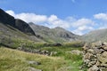 In valley by sheepfold looking to Scafell Pike