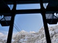 Valley terminal of Saentis cable car in Schwaegalp looking up to Saentis in winter. Alpstein, Appenzell, Switzerland.