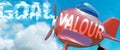 Valour helps achieve a goal - pictured as word Valour in clouds, to symbolize that Valour can help achieving goal in life and Royalty Free Stock Photo