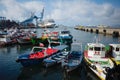 Boats and runabouts moored in port of Valparaiso near Muelle Prat pier.