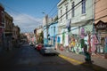 City street in Barrio Bellavista district with colorful houses and walls decorated with graffiti Royalty Free Stock Photo