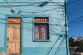 Valparaiso colorful house with power lines shadows from utility poles Royalty Free Stock Photo