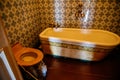 Valtice, Southern Moravia, Czech Republic, 04 July 2021: Castle interior with baroque wooden carved furniture, antique bathroom