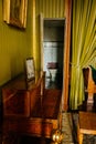 Valtice, Southern Moravia, Czech Republic, 04 July 2021: Castle interior with baroque wooden carved furniture, green bedroom with