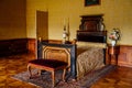 Valtice, Southern Moravia, Czech Republic, 04 July 2021: Castle interior with baroque wooden carved furniture, yellow bedroom with
