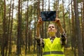 valuation and appraisal of forest. appraiser taking pictures of trees, biomass estimation