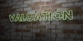 VALUATION - Glowing Neon Sign on stonework wall - 3D rendered royalty free stock illustration
