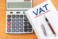 Value Added Tax VAT Finance Taxation Accounting Concept, VAT word handwritten on notebook Royalty Free Stock Photo