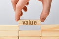 Value concept - hand holds wooden block with the inscription Royalty Free Stock Photo