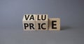 Value and Price symbol. Wooden cubes with words Price and Value. Beautiful grey background. Business and Value and Price concept. Royalty Free Stock Photo