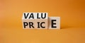 Value and Price symbol. Wooden cubes with words Price and Value. Beautiful orange background. Business and Value and Price concept Royalty Free Stock Photo