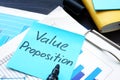 Value proposition. Financial documents with business figures.