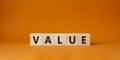 Value symbol. Concept word value on wooden cubes. Beautiful orange background. Business and value concept. Copy space Royalty Free Stock Photo