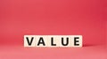 Value symbol. Concept word value on wooden cubes. Beautiful red background. Business and value concept. Copy space Royalty Free Stock Photo