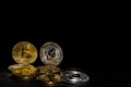 valueable golden bitcoin and silver ether coins from cryptocurrency on black