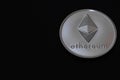 valueable silver ether coin from cryptocurrency on black right