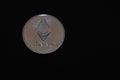 valueable silver ether coin from cryptocurrency middle on black
