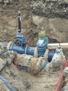 Valve and HDPE pipe welded underground. City water system Royalty Free Stock Photo