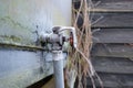 valve and pipe seen attached to an agricultural diesel storage tank. Royalty Free Stock Photo