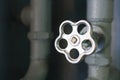 The valve of the water supply system close-up. Crane and pipes in the basement with copy space Royalty Free Stock Photo