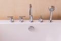 Valves, faucet and shower head of of modern style bath tub Royalty Free Stock Photo