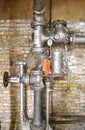 Valves, gauges, and pluming of an oldmheating system in a warehouse