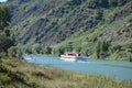 Valwig, Germany - 09 17 2020: Big passenger ship passing a small boat on the Mosel Royalty Free Stock Photo
