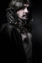 Vampire with black coat and long hair Royalty Free Stock Photo