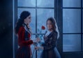 vampire woman gives red rose beauty blonde girl princess. backdrop fairy night