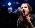 Vampire woman on night background