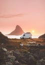 Van car camper at sunset ocean beach road trip in Norway Royalty Free Stock Photo