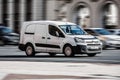 Van car Citroen Berlingo Second generation B9 drive on the city road. Fast moving white commercial auto Royalty Free Stock Photo