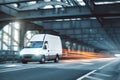 Van driving on a road through an industrial style bridge Royalty Free Stock Photo