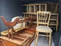 A van full of wooden chairs and furniture