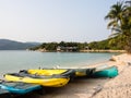 Kayaks on a sandy beach at Whale Island resort on a remote and isolated Whale Island