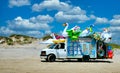 Van parked on a beach selling inflatable beach toys Royalty Free Stock Photo