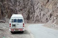 A van parking on mountain road in Ladakh, India