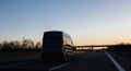 Van silhouette driving at dusk on European highway German autoba