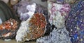 Vanadinite crystals in the middle of various natural stones